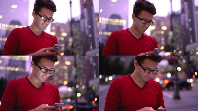英俊的西班牙男性博主眼镜视力矫正更新通知手机连接到4g无线浏览网站