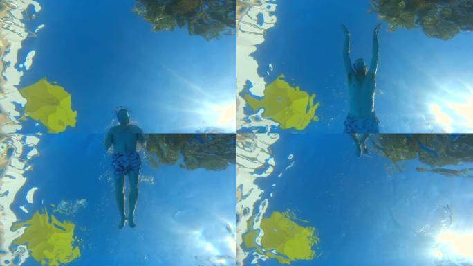 一名戴着潜水镜的男子在镜头前游泳