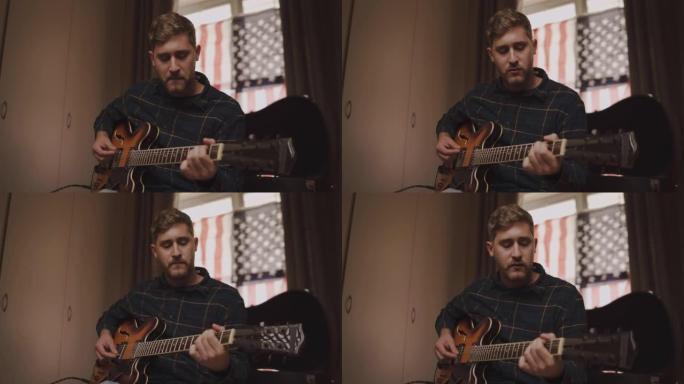 一个年轻人在家里弹吉他时唱歌的肖像