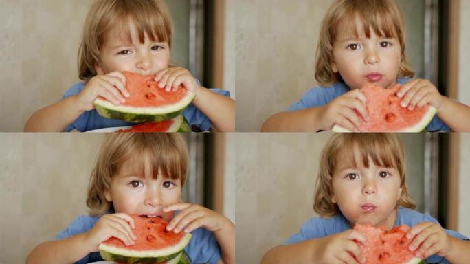 一个小男孩正在吃一个大西瓜。孩子的肖像吃西瓜片。4K UHD。