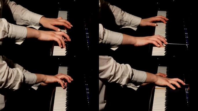 女人的手在弹钢琴。古典音乐