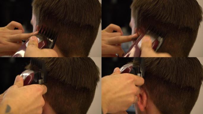 理发师用机器特写给男人理发