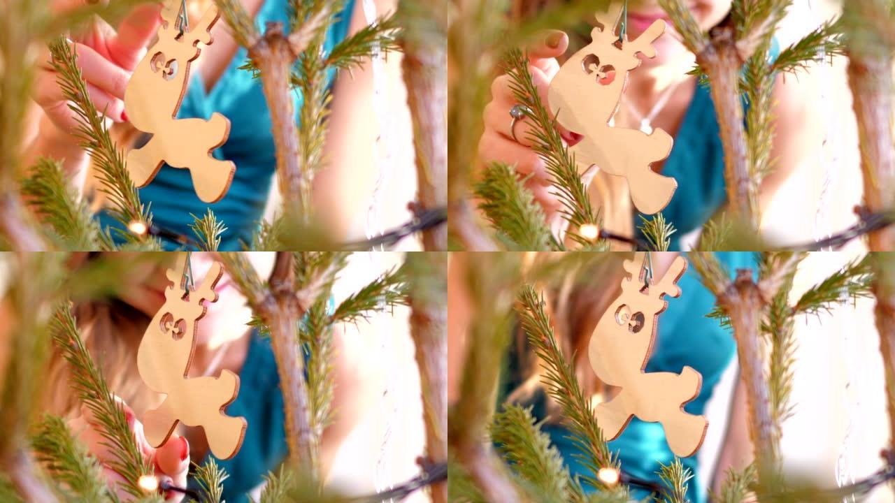 慢动作特写女孩触摸圣诞树上的兔子