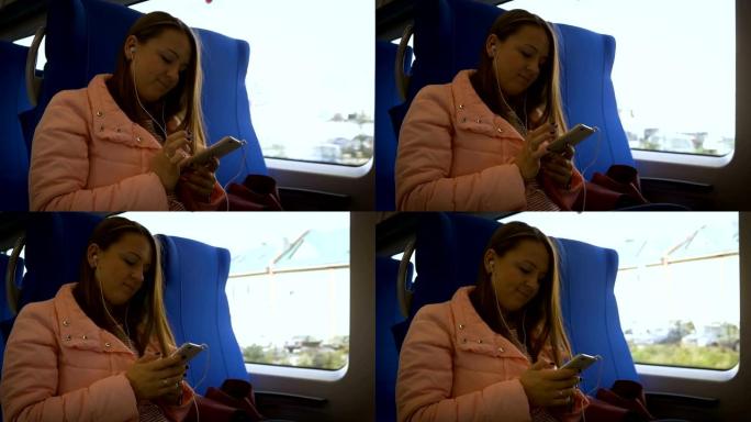 火车上年轻漂亮的女人穿着白色耳机从智能手机听音乐