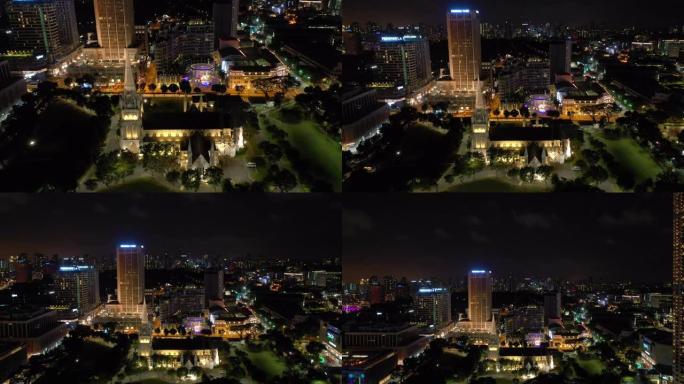 夜景照亮了新加坡市中心著名的大教堂，4k航拍全景