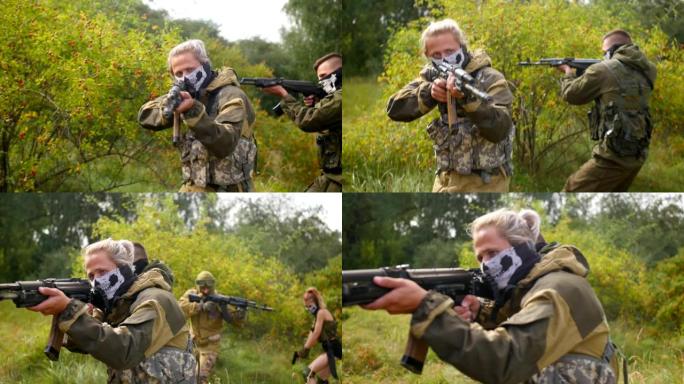 俄罗斯加里宁格勒——2019年8月:激光枪战游戏。士兵们的目标。男人在森林里玩软球。戒严。中景镜头。