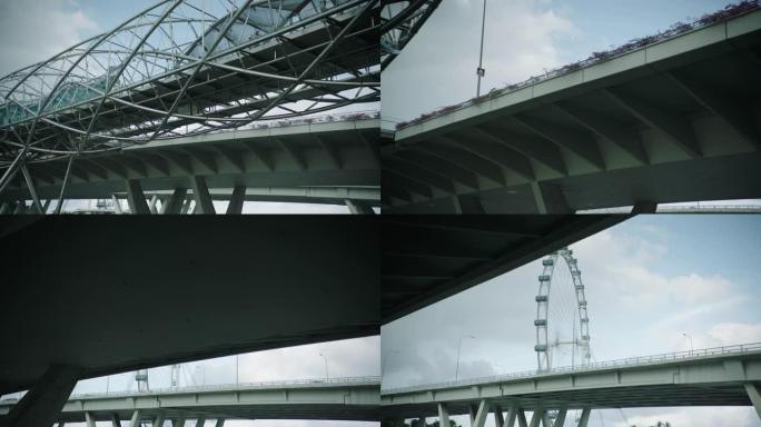 从新加坡河上的一艘船上拍摄的Helix Bridge和Singapore Flyer