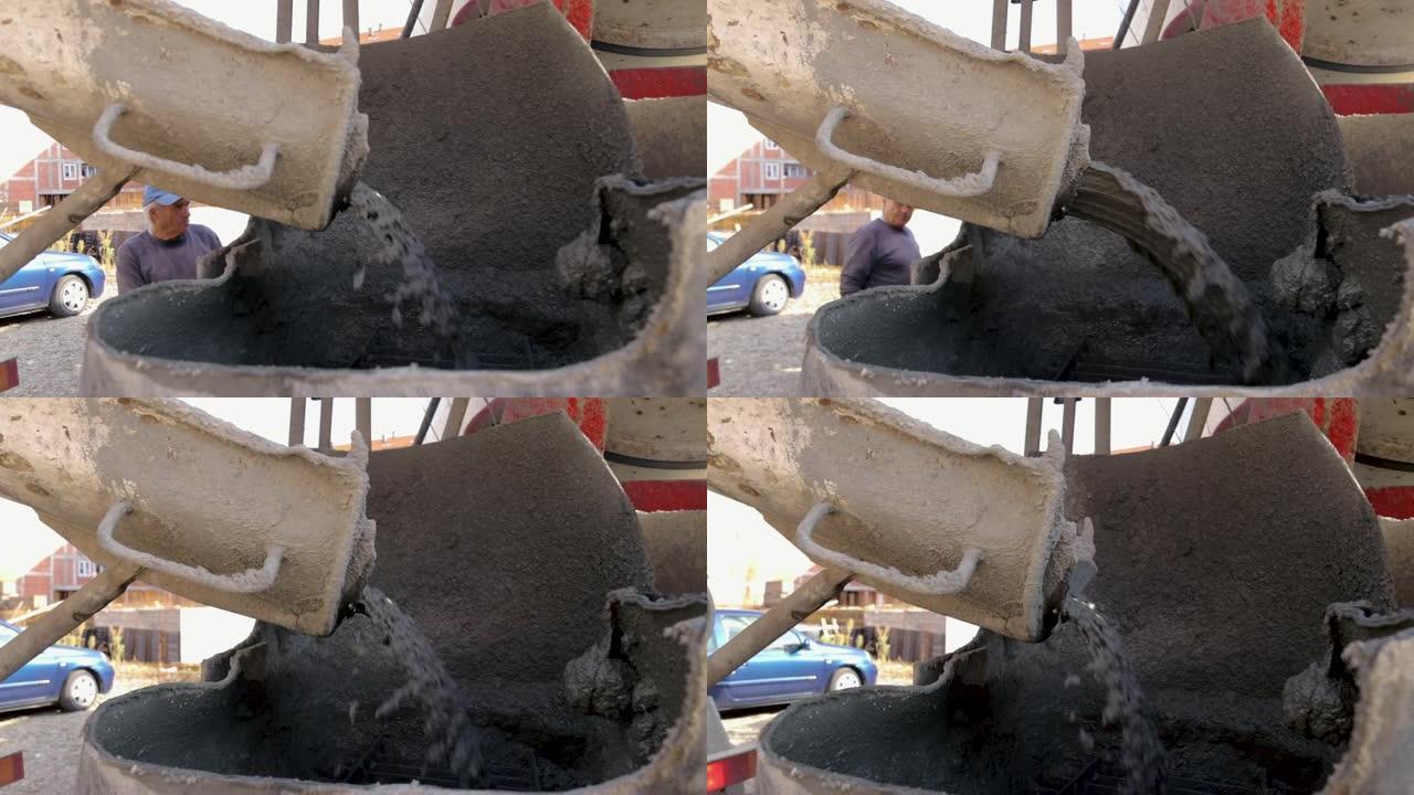 混凝土搅拌车的后视图。水泥搅拌机背面脏的细节