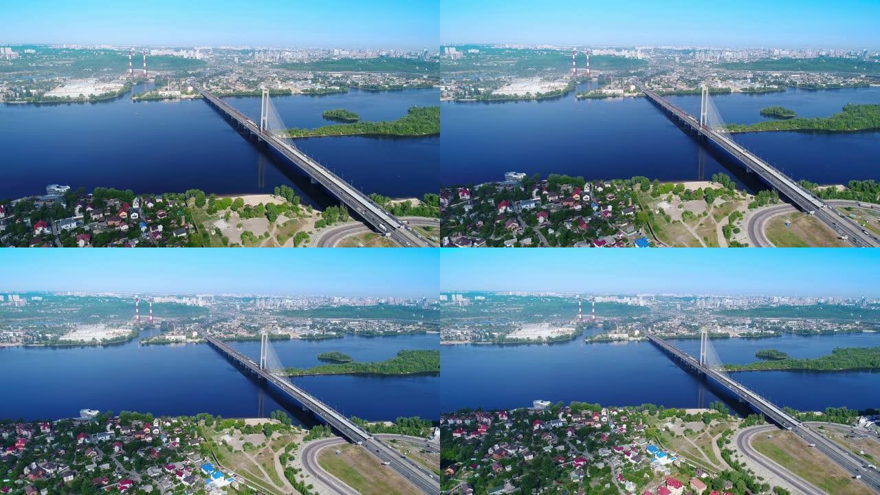 基辅市南桥的空中无人机。乌克兰。第聂伯河，桥过河。河上的城市景观鸟瞰桥两个人爬到桥顶