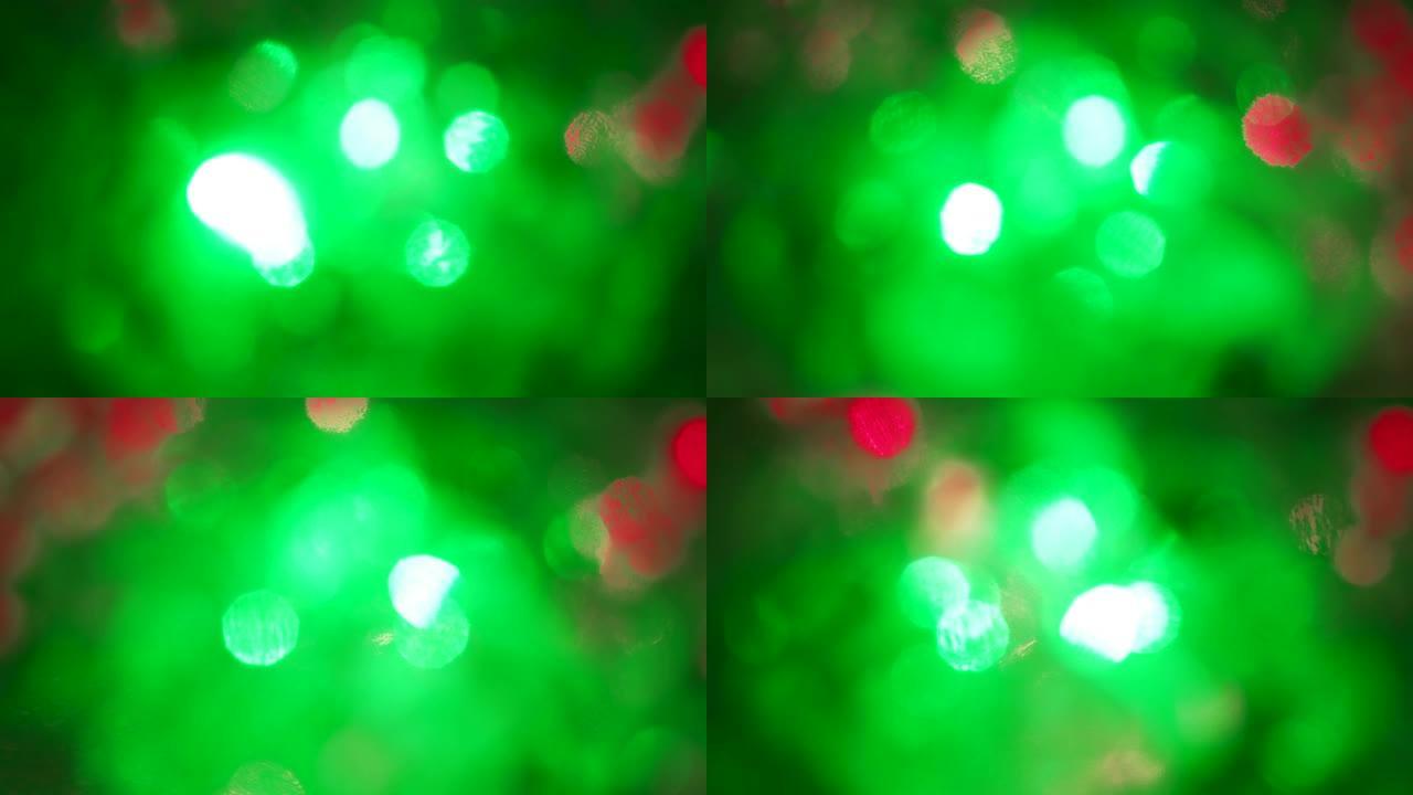 带有霓虹灯的圣诞节色彩缤纷的bokeh。抽象模糊的背景与闪烁的粉红色蓝色绿色红色手电筒。闪烁彩色镜头