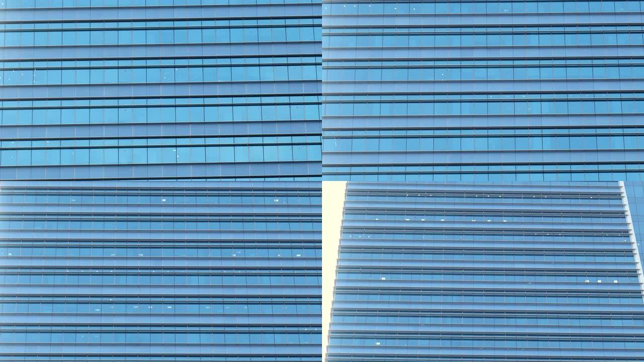 城市现代办公摩天大楼的玻璃窗立面