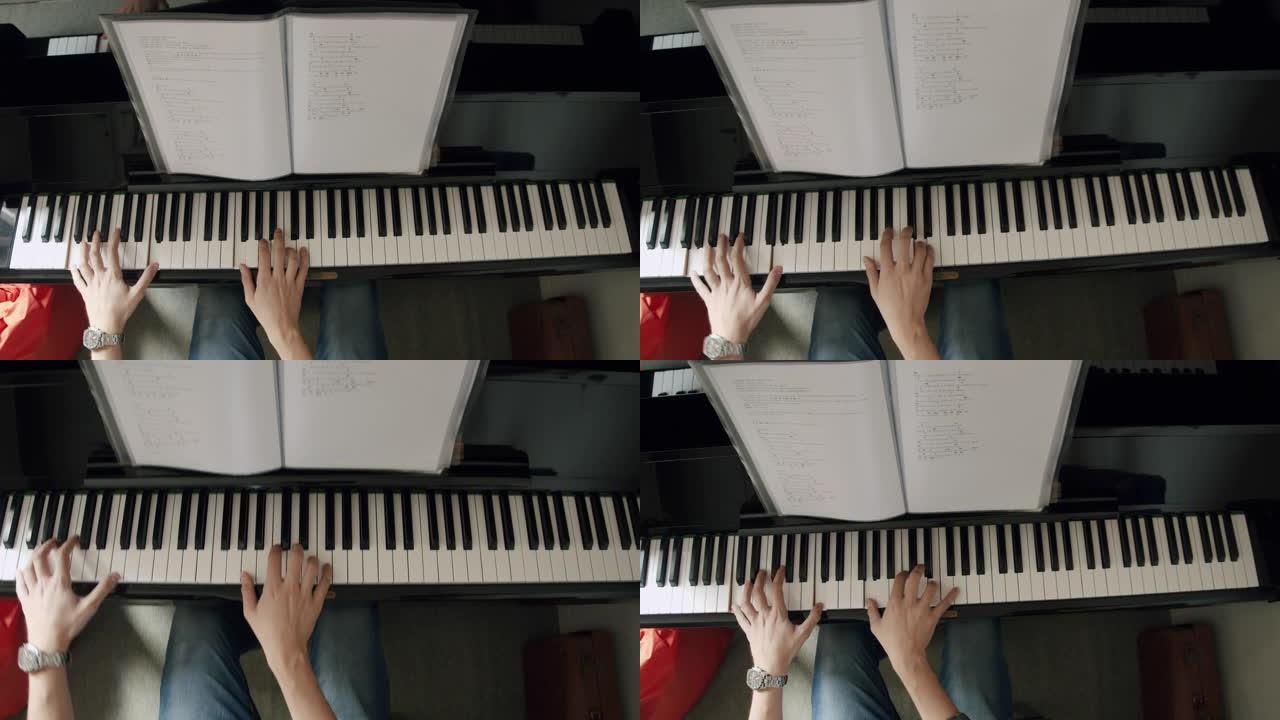 钢琴家弹钢琴的俯视图