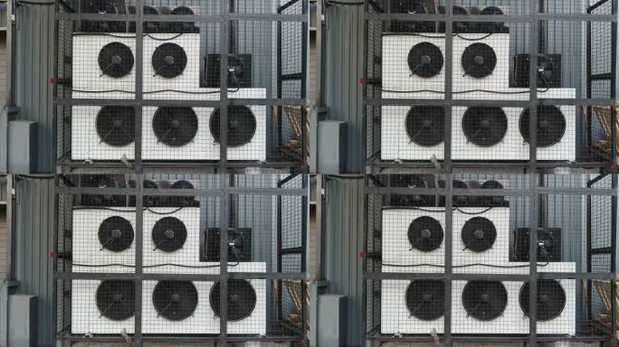 工业建筑附近的工业空调机组暖通空调，带工作风扇。静态4k视频素材