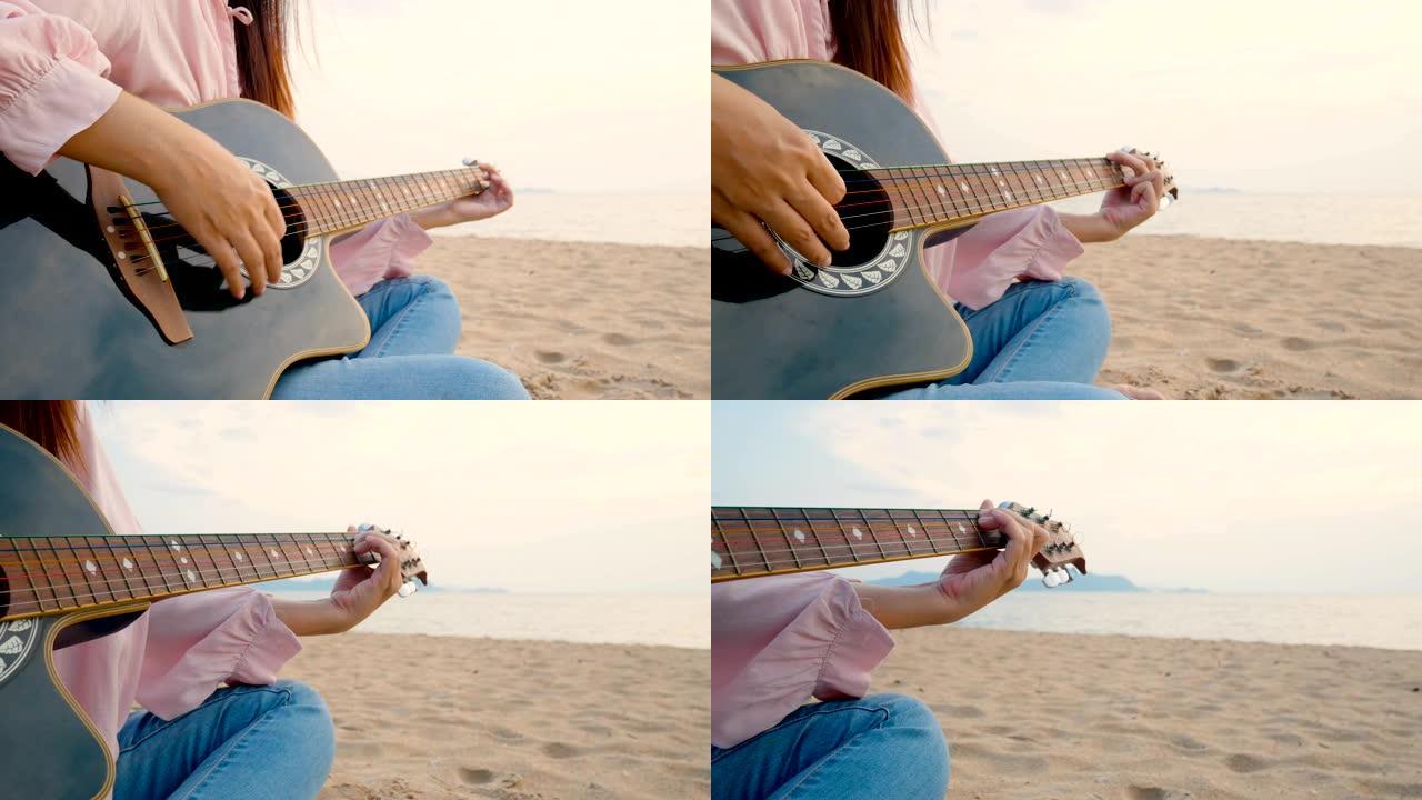 4K。日落时分，长发女人在沙滩上弹奏木吉他，轻风，放松身心