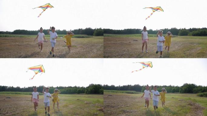 快乐的童年，快乐的朋友孩子们在大自然中放松的同时，在天空中用风筝奔跑