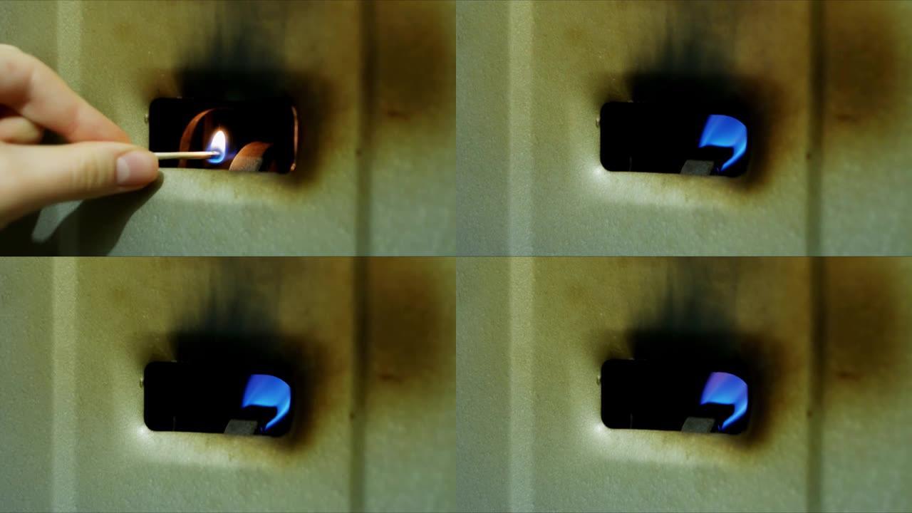 间歇泉，热水器。火炬的火焰燃烧，气体铜用于水加热。锅炉炉内天然气点火燃烧的特写