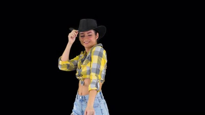 戴着牛仔帽的年轻女士在阿尔法频道跳舞