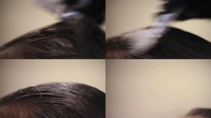 发型师使用染发剂来减轻发色