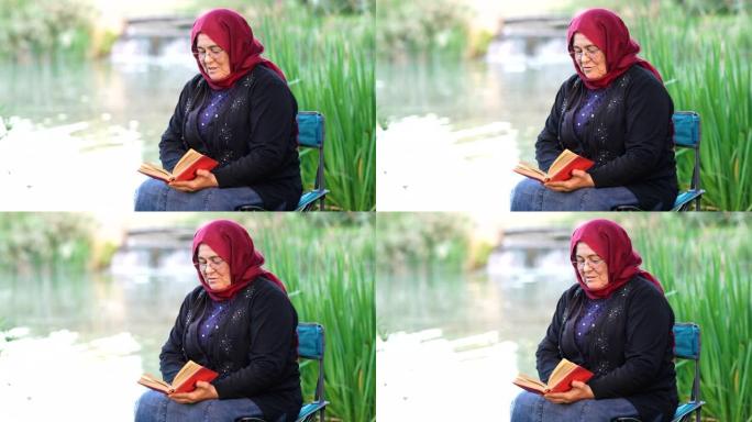 穆斯林妇女在公园读书