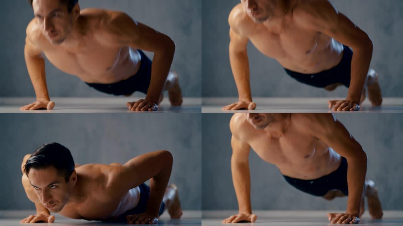 赤裸上身的年轻运动瘦子在家里做俯卧撑。男性健身训练。健康的生活方式。