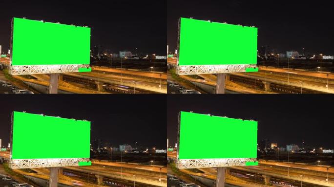 泰国曼谷城市背景下的黄昏期间，高速公路上广告广告牌的延时绿屏。