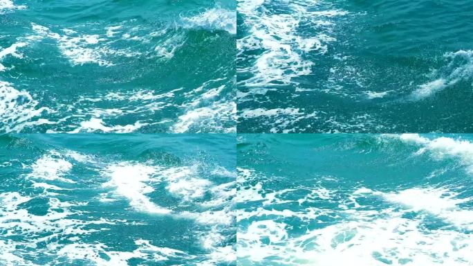海面上的波浪驱动船蓝色的水