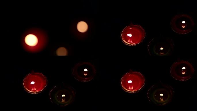排灯节节日期间，黑暗背景上的排灯节diyas用于照亮房子