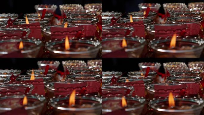 庆祝农历新年期间，道观教堂燃烧的油烛灯产生的火焰。仁慈女神神庙。4k