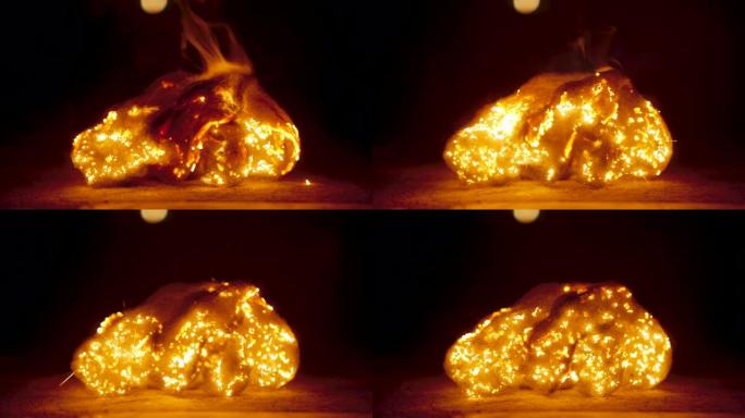 大火的特写镜头通过钢丝绒燃烧并导致其散开