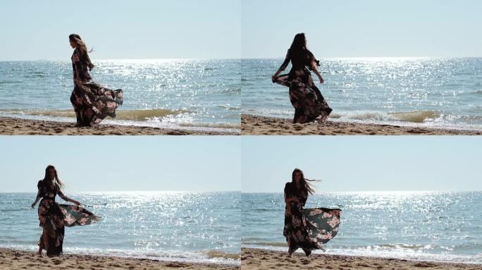 迷人的女孩在暑假快乐的一天在海边享受。
