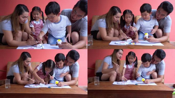 父亲和母亲教儿子和女儿绘画技巧