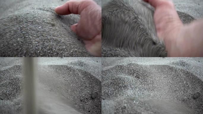 4k的手视图sc起一把沙子并溢出