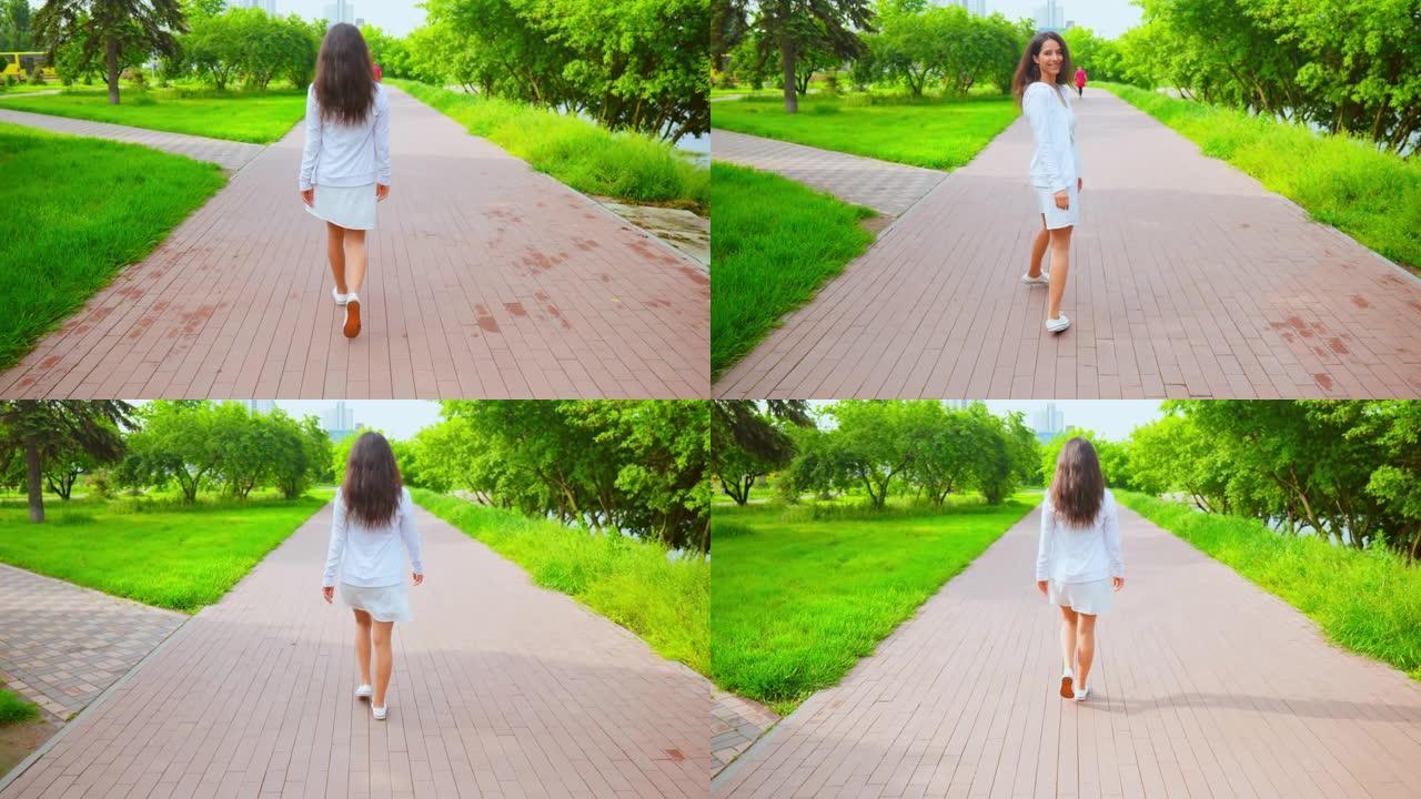 穿着白色连衣裙和运动鞋的快乐女孩散步