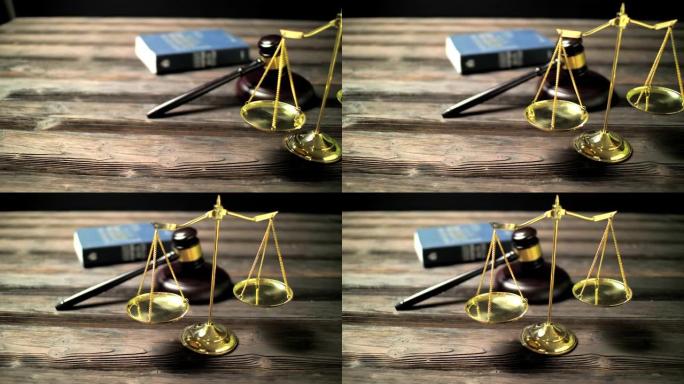 律师和律师办公室的法律道具。法官的木槌，公正的尺度和律师的法律书籍。平移4K视频