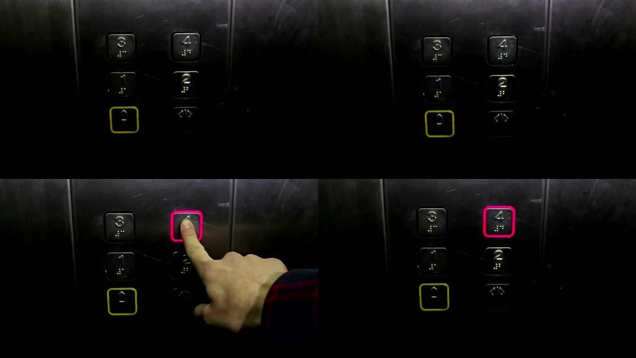 一个年轻女孩的手按下电梯呼叫按钮。