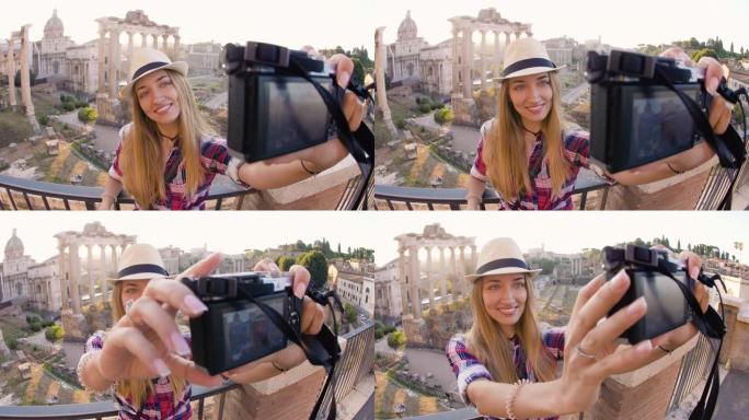 日出时，长发和蓝眼睛的快乐年轻金发女子在罗马论坛用老式相机自拍。意大利罗马