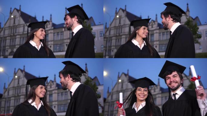 毕业那天快乐的年轻夫妇对镜头微笑