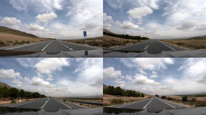 4k pov在安达卢西亚的沥青路面上行驶，云层分散而低