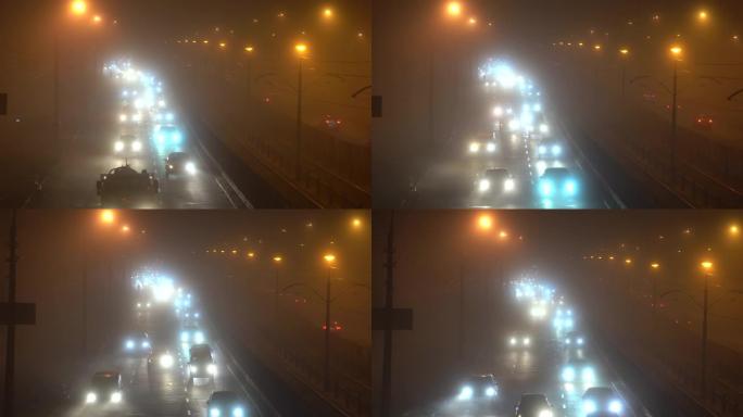 天气。大雾。汽车在大雾中行驶。夜间汽车交通。
