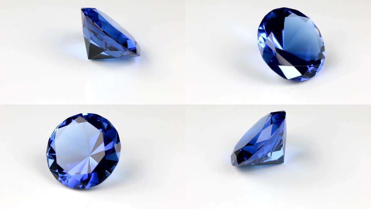 在白色背景上旋转一个大的蓝色水钻。钻石纹理的美丽光反射。