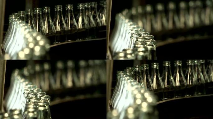 可乐瓶玻璃制造工业工厂。在传送带上移动的空透明瓶子。技术线生产