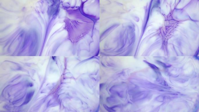水中墨水。紫色墨水在水中反应产生抽象背景。