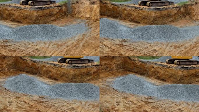 施工现场挖掘机基础挖掘机回填中施工现场砾石的回填沟