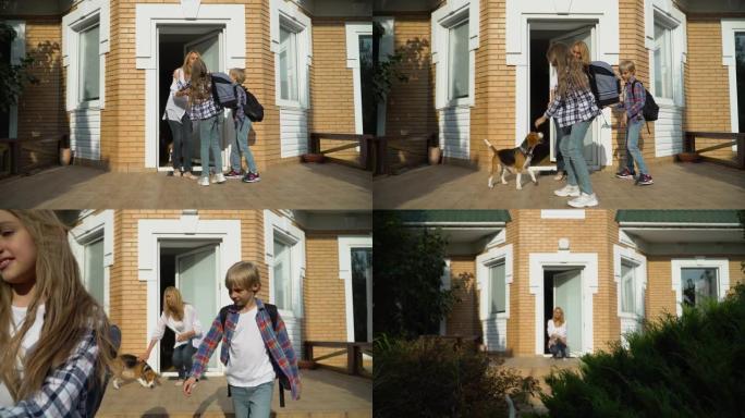 带着背包的小可爱兄妹离开家去上学。