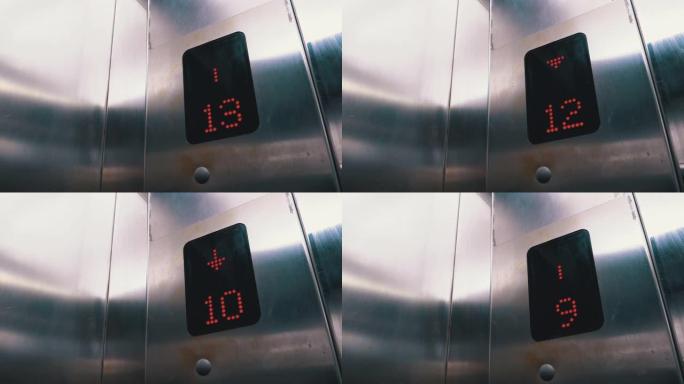 带有箭头向下的电梯中的数字显示显示从15到7的楼层