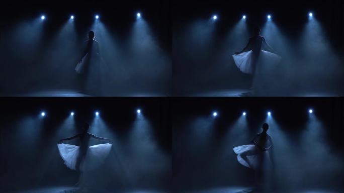 优雅的芭蕾舞演员穿着白色芭蕾舞短裙跳舞古典芭蕾舞剧。慢动作