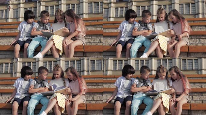 友好的一群孩子在户外看书