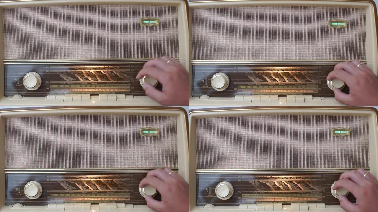 收藏家展示了一个旧收藏家收音机的性能