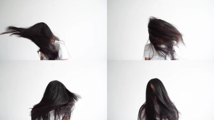 4k慢动作，亚洲女人在抖头发。