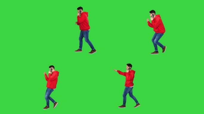 休闲嘻哈男人在电话上走路和聊天，在绿色屏幕上跳舞，色键
